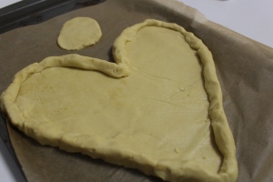 Before the pizza dough is baked! I made mine into a heart and had a little extra for a small pancake pizza.